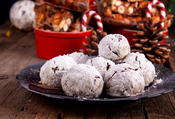 Traditional Christmas almond chocolate snowballs cookies biscuits covered icing sugar powder. Russian Tea Cakes, Mexican Wedding Cookies, Butterballs.