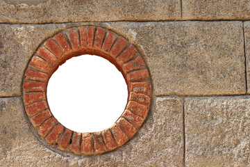 Obraz na płótnie Canvas Close-up of a small round window with brick frame isolated on white or transparent background with copy space. La Spezia province, Liguria, Italy, Europe. Png.