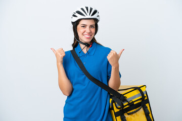 Young delivery woman with thermal backpack isolated on white background with thumbs up gesture and smiling