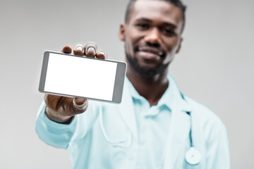 Black health specialist, displays phone, quick aid