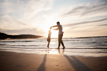 Love, swing and father with girl child at a beach holding hands in nature for play, freedom or bond...