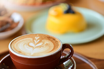 high angle view of coffee cup on wood grain table Drinking Concept: Hot Coffee, Latte, Espresso, Cappuccino
