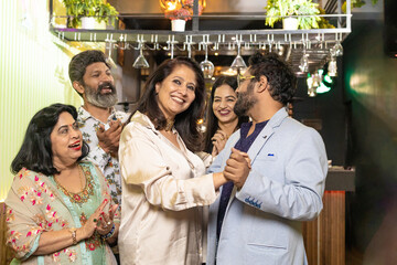 Indian couple dancing at restaurant