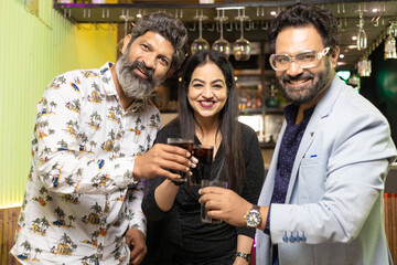 Indian people enjoying party at restaurant.