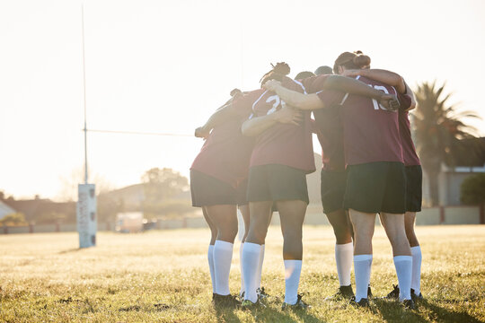 Rugby, training and a sports team in a huddle on a field for a game, competition or fitness practice. Teamwork, exercise and workout with a group of athlete men in a circle together for preparation