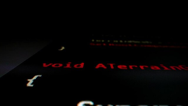 Closeup macro shot movement of coding script moving across LED screen with real-time AI-generated typing, showcasing advanced AI learning in optimization, debug and coding for software development.