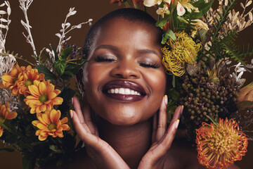 Skincare, cosmetics and protea with the face of a black woman in studio on brown background for natural treatment. Smile, plant or beauty and a happy model for eco or aesthetic wellness with flowers