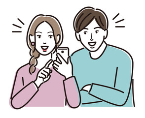 スマホを見る若い男女