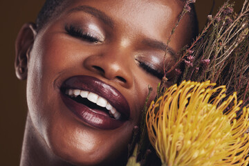 Skincare, beauty and plant with the face of a black woman in studio on brown background for natural...