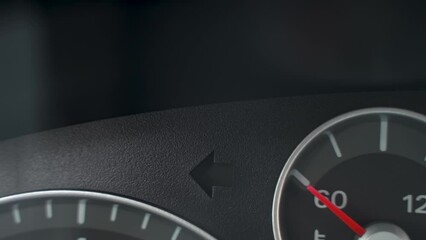 automotive theme
 turn signal or emergency stop signal on car dashboard close-up
the green car is parked with turn signal or emergency stop signal on
road safety concept