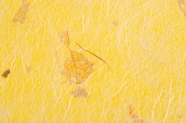 The Yellow color mulberry paper texture background in close-up.