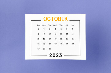The October 2023 Monthly calendar for 2023 year on purple background.