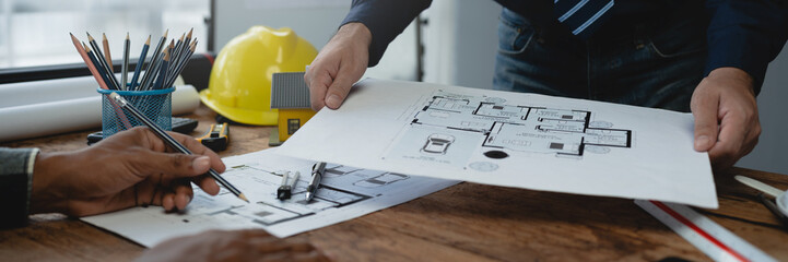 Structural engineer team discussing and calculating work Office design of the building structure concept of the construction project. building model meeting concept business objects