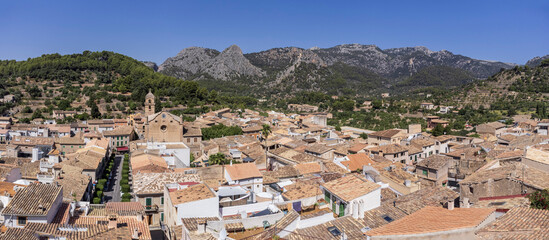 Fototapeta na wymiar Bunyola,view of the town with the Sierra de Tramuntana in the background and the mountain Teix. Majorca, Balearic Islands, Spain