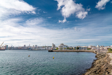Fototapeta premium View of spectacular Marina Real Port. Beautiful cruise ship docked in the bay. Yachts and fishing boats. Travel destination in Galicia, North of Spain
