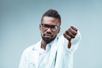 Black doctor's thumbs-down; disapproves unscientific choices