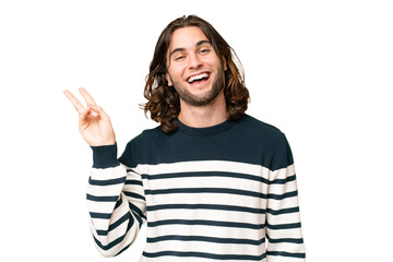 Young handsome man over isolated background smiling and showing victory sign