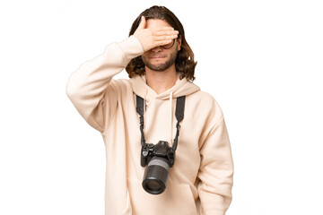 Young photographer man over isolated background covering eyes by hands. Do not want to see something