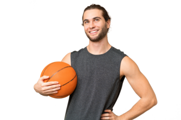 Young basketball player man over isolated background posing with arms at hip and smiling