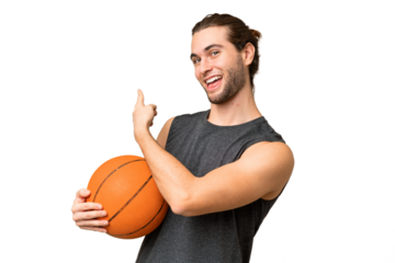 Young basketball player man over isolated background pointing back