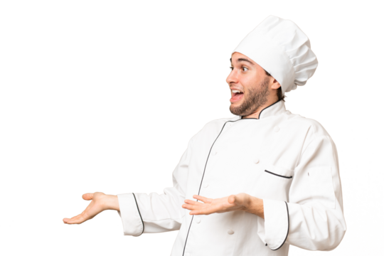 Young handsome chef man over isolated background with surprise facial expression