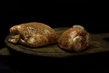 Raw seasoned chicken thigh and leg.