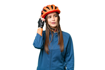 Young cyclist woman over isolated chroma key background having doubts and with confuse face expression