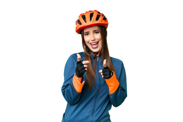 Young cyclist woman over isolated chroma key background pointing to the front and smiling