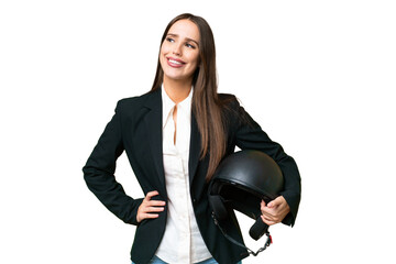 Young Asian woman with a motorcycle helmet over isolated chroma key background posing with arms at hip and smiling