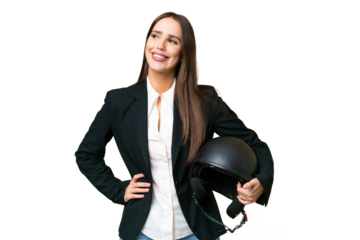 Young Asian woman with a motorcycle helmet over isolated chroma key background posing with arms at hip and smiling