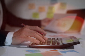 Research Financial and Accounting concept, Accountant using calculator for calculate finance report in office, analyst report profits and growth, Market research reports and income statistics