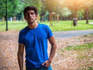Fototapeta premium Three quarters shot of one handsome young man in urban setting