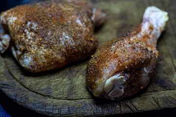 Raw seasoned chicken thigh and leg.