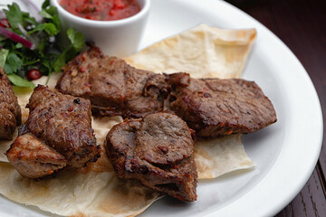 Shish kebabs on a white plate