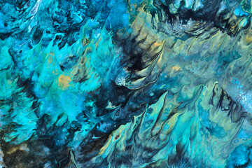 Exclusive beautiful pattern, abstract fluid art background. Flow of blending blue paints mixing together. Blots and streaks of ink texture for print and design.