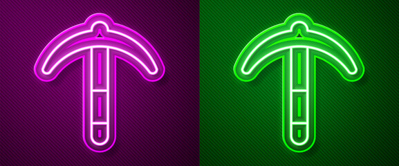 Glowing neon line Pickaxe icon isolated on purple and green background. Vector