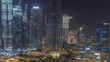 Naklejka premium Dubai Downtown all night with tallest skyscraper and other towers