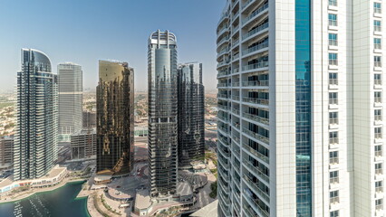 Panorama showing tall residential buildings at JLT aerial timelapse, part of the Dubai multi commodities centre mixed-use district.