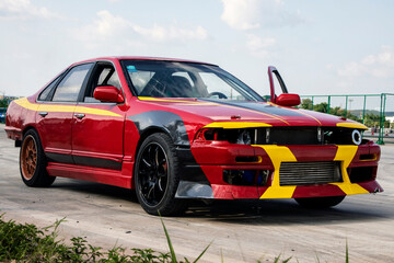drift, red car with yellow stripes, black wheels
