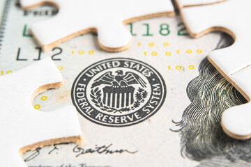 The Federal Reserve System with jigsaw puzzle paper, the central banking system of the United States of America.
