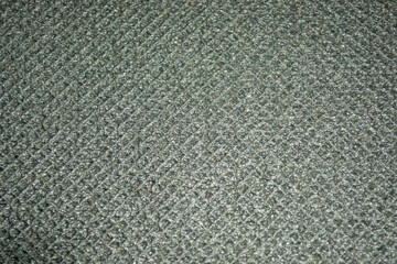 Dark gray abstract background in rhombics. Background for the base. Gray background knitted canvas. Grey knitted fabric
