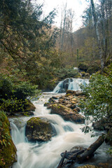 long exposure photo of waterfall in the mountains