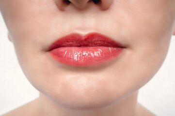 Fototapeta premium Women's lips are red, close-up. Seductive red lips