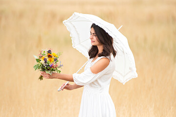young woman looks at colorful bouquet