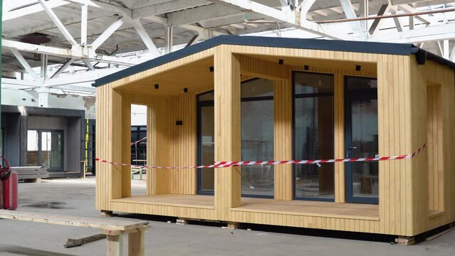 Exhibition of new and modern prefabricated modular house from composite wood panels. Energy efficient panel assembling