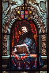 A character painted on a stained glass window in the castle of Fontainebleau in France