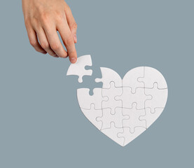 Hand helping with lacking puzzle piece, solving problem, finding solution