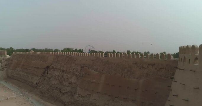 A drone flies along the old wall of a fortress in Bukhara near the Talipach Gate