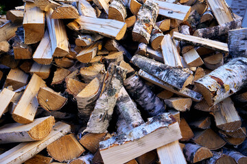 Birch chopped firewood piled in a pile. Clouse-up, pattern.