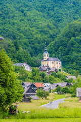 Fototapeta na wymiar A view leading into the alpine village of Kranjska above lake Bohinj in Slovenia in summertime